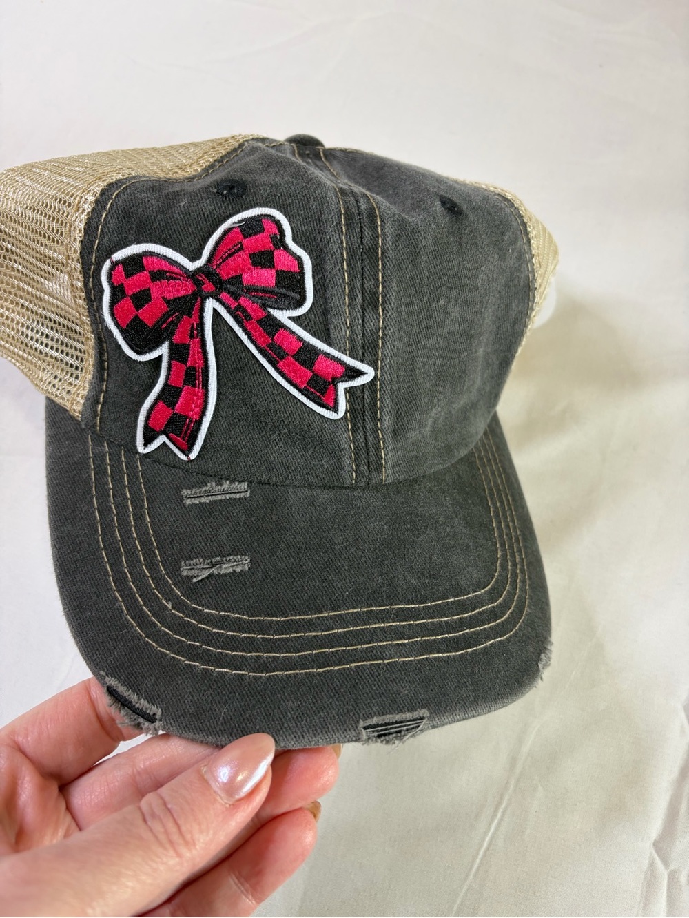 Distressed Black Trucker Hat with Pink Checkered Bow Patch distressed women’s